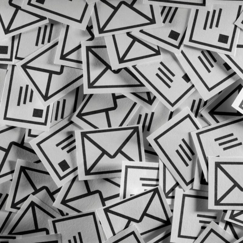 A pile of black and white envelope icons