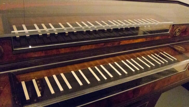 A piano keyboard with reversed black and white keys, reflecting early piano designs
