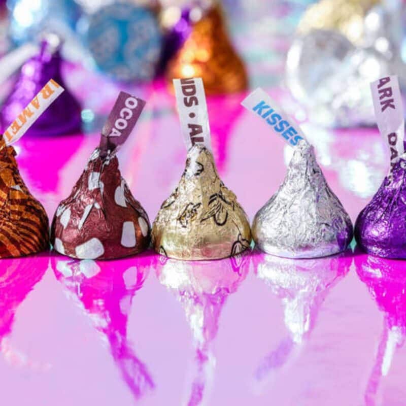 Colorful Hershey's Kisses with plumes extending from their tops
