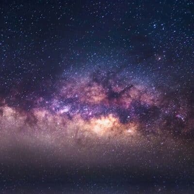 A vibrant section of the Milky Way galaxy with clusters of bright stars amid clouds of gas and dust