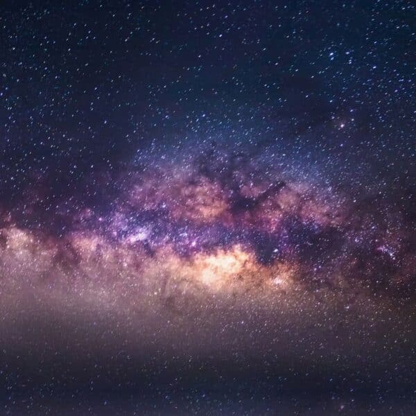 A vibrant section of the Milky Way galaxy with clusters of bright stars amid clouds of gas and dust