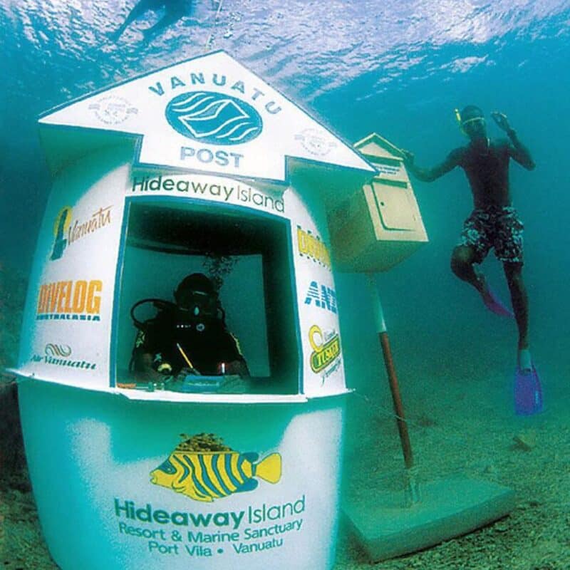 A scuba diver is inside the underwater post office at Hideaway Island in Vanuatu