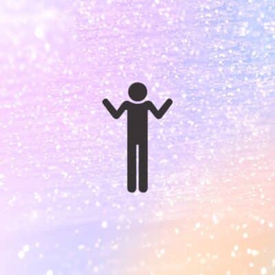 Silhouette of a person with raised arms against a glittery background