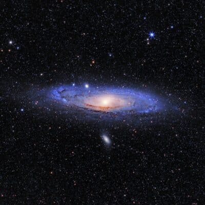 The Andromeda Galaxy surrounded by numerous stars in space