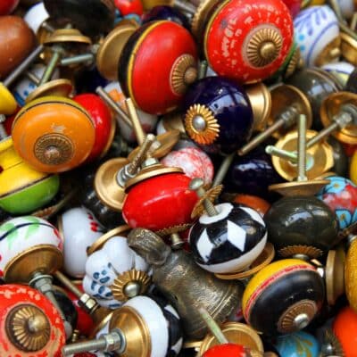 Colorful collection of antique ceramic and metal doorknobs