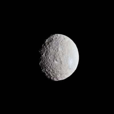 Ceres, a heavily cratered dwarf planet against a black background
