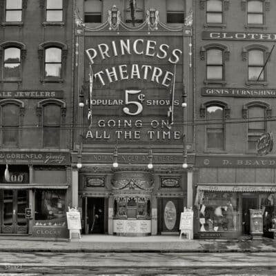 Front of the Princess Theatre advertising 5-cent shows, flanked by early 20th-century storefronts