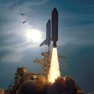 A space shuttle launches from a launch pad with flames and smoke billowing beneath
