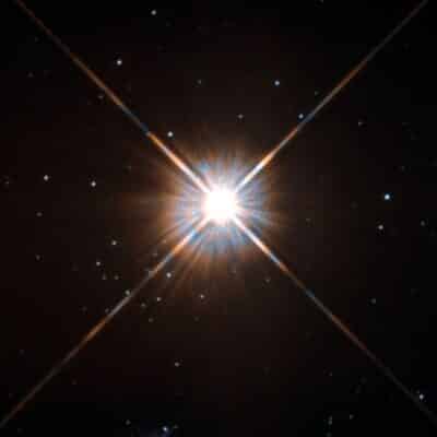 Bright Proxima Centauri with prominent diffraction spikes and surrounding faint stars
