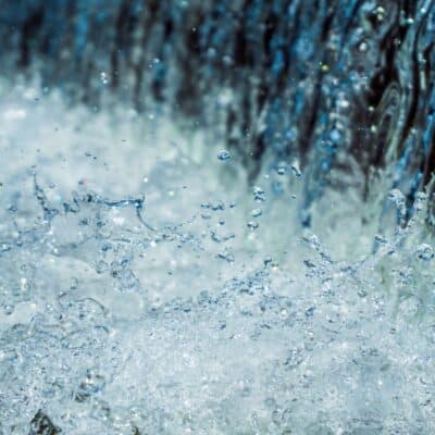 Flowing water with splashes and droplets