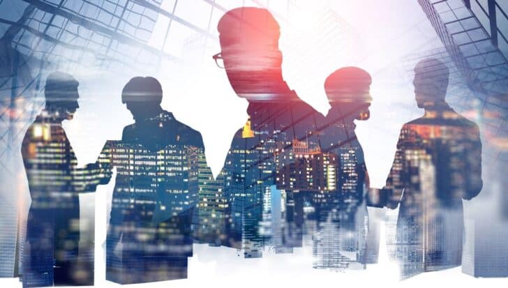 Silhouettes of people in a business setting with cityscape background, illustrating non-undercover roles in the CIA
