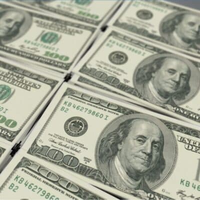 Stacks of US hundred-dollar bills featuring Benjamin Franklin