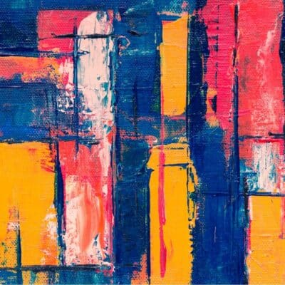 Abstract painting with bold blocks of blue, yellow, red, and white