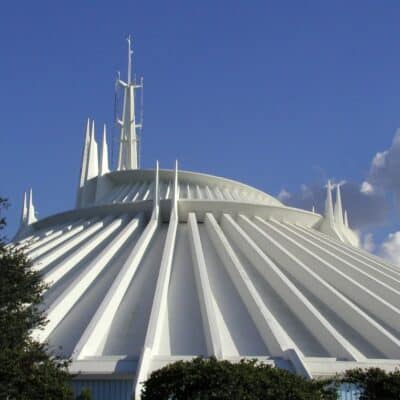 White futuristic dome of Disney’s Space Mountain against a blue sky