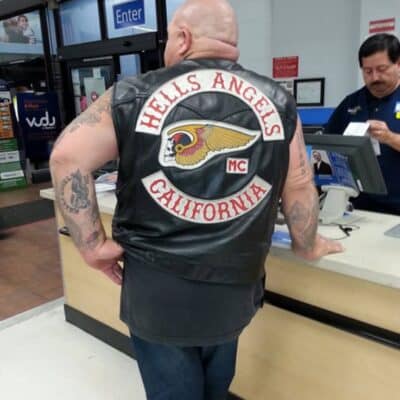 Hells Angels member in leather vest at Walmart checkout counter