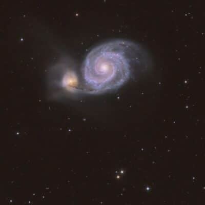 Spiral galaxy Messier 51 interacting with a smaller companion galaxy