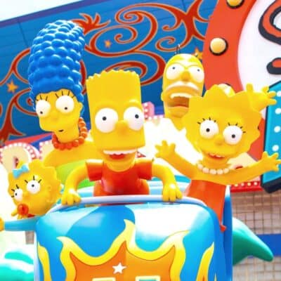 The Simpsons characters on a colorful amusement ride