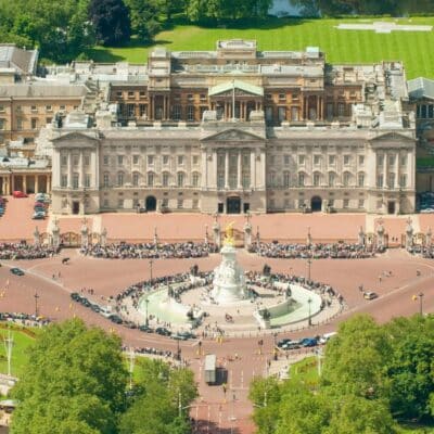 Aerial view of Buckingham Palace with crowds around the Victoria Memorial