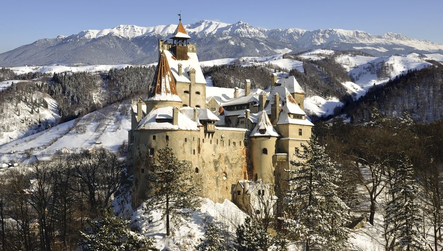  Scenic landscape in Transylvanian winter with a castle in the foreground