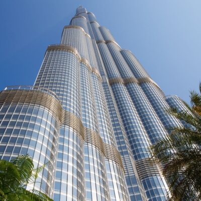 Upward view of the Burj Khalifa with glass windows reflecting sunlight