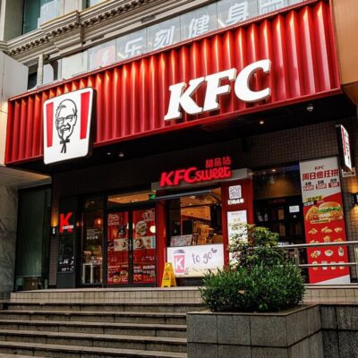 Exterior of a KFC restaurant in China with signage and menu displays