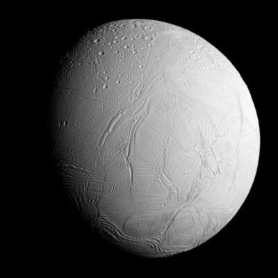 Saturn’s moon Enceladus with icy surface and visible fractures