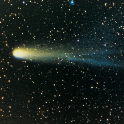 Halley's Comet streaking through a star-filled night sky