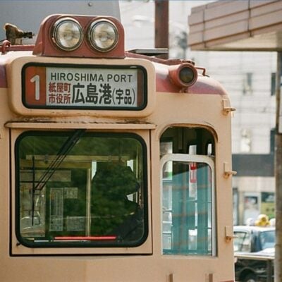 Front of a Hiroshima tram marked with route number 1 to Hiroshima Port