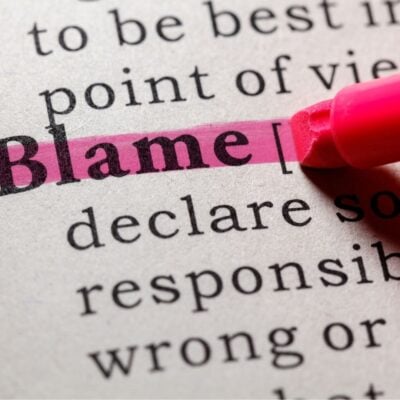The word 'Blame' highlighted in pink in a dictionary entry