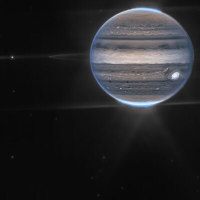 Jupiter with faint ring system and Great Red Spot visible in space