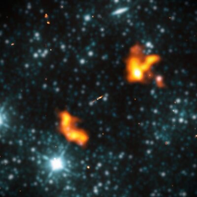 Alcyoneus galaxy with giant orange radio jets extending into deep space