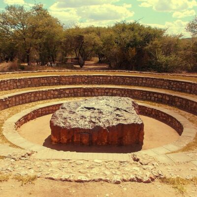 Hoba meteorite displayed in a circular stone enclosure in Namibia