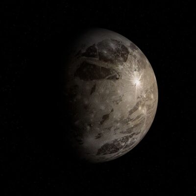 Ganymede with visible surface features against a starry background