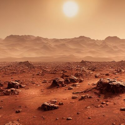 Rocky Martian landscape with dusty hills under a bright sun