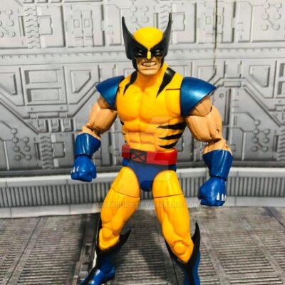 Wolverine action figure in yellow and blue costume standing on a sci-fi backdrop