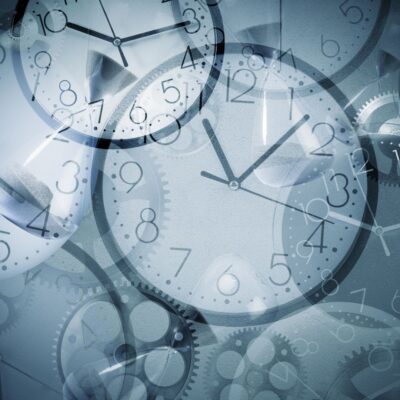 Multiple overlapping clock faces, hourglasses, and gears in a blue-toned design