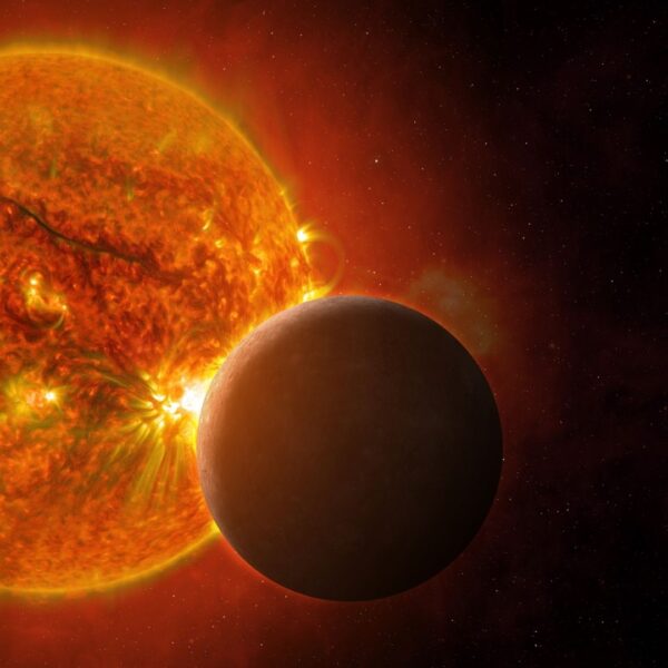 Mercury passing in front of the Sun with solar flares visible
