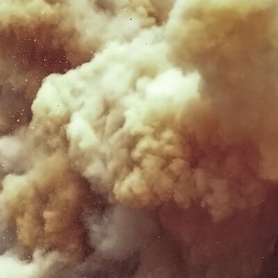 Thick cloud of brown and gray dust particles in the air