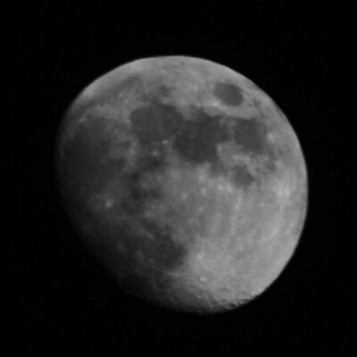Close-up of the Moon showing its slightly uneven, bulging shape