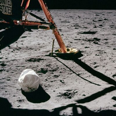 Lunar module leg and discarded white bag on the Moon’s surface