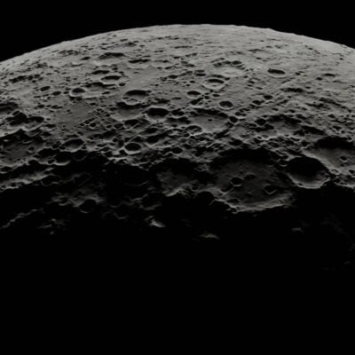 Heavily cratered surface of the Moon in shadowed light