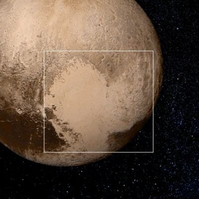 Pluto with heart-shaped Tombaugh Regio prominently visible against a starry background