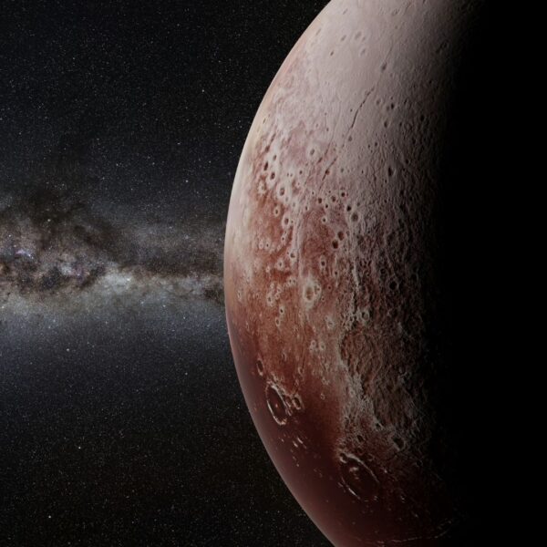 Partially shadowed view of Pluto's cratered surface against a starry background
