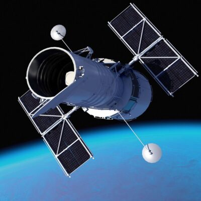 Hubble Space Telescope orbiting above Earth with solar panels extended