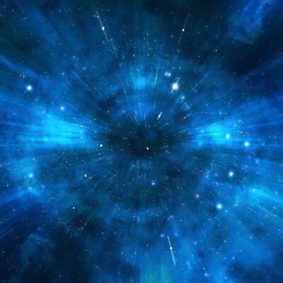 Bright stars and glowing blue light in deep space