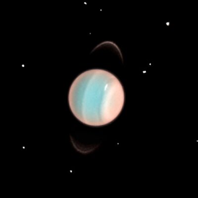 Uranus with faint rings and a blue-pink atmosphere in space