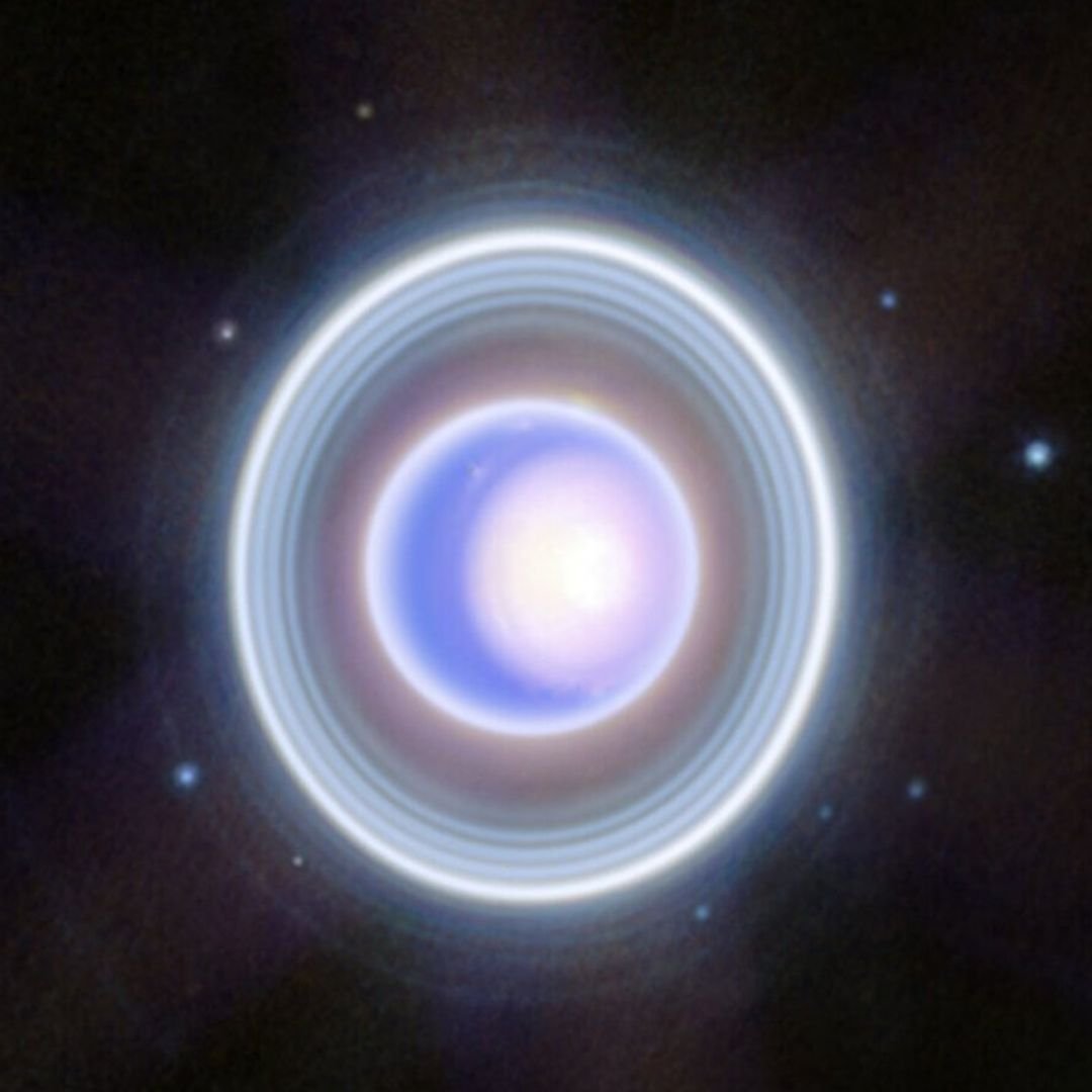 Uranus spins on its side with an axis tilted about 98 degrees, meaning its poles point nearly where most planets’ equators do.