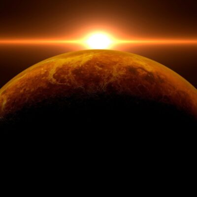 Sunrise over the surface of Venus with glowing orange light