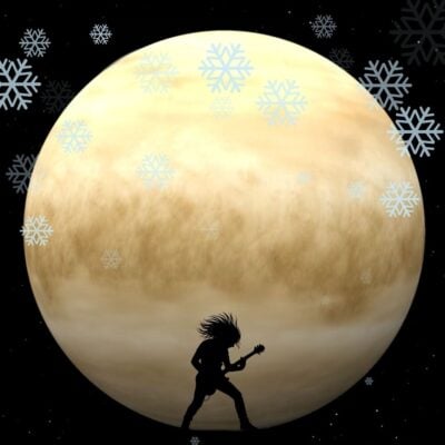 Silhouette of a guitarist in front of Venus with snowflakes falling