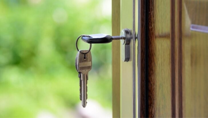 A set of keys in a door lock